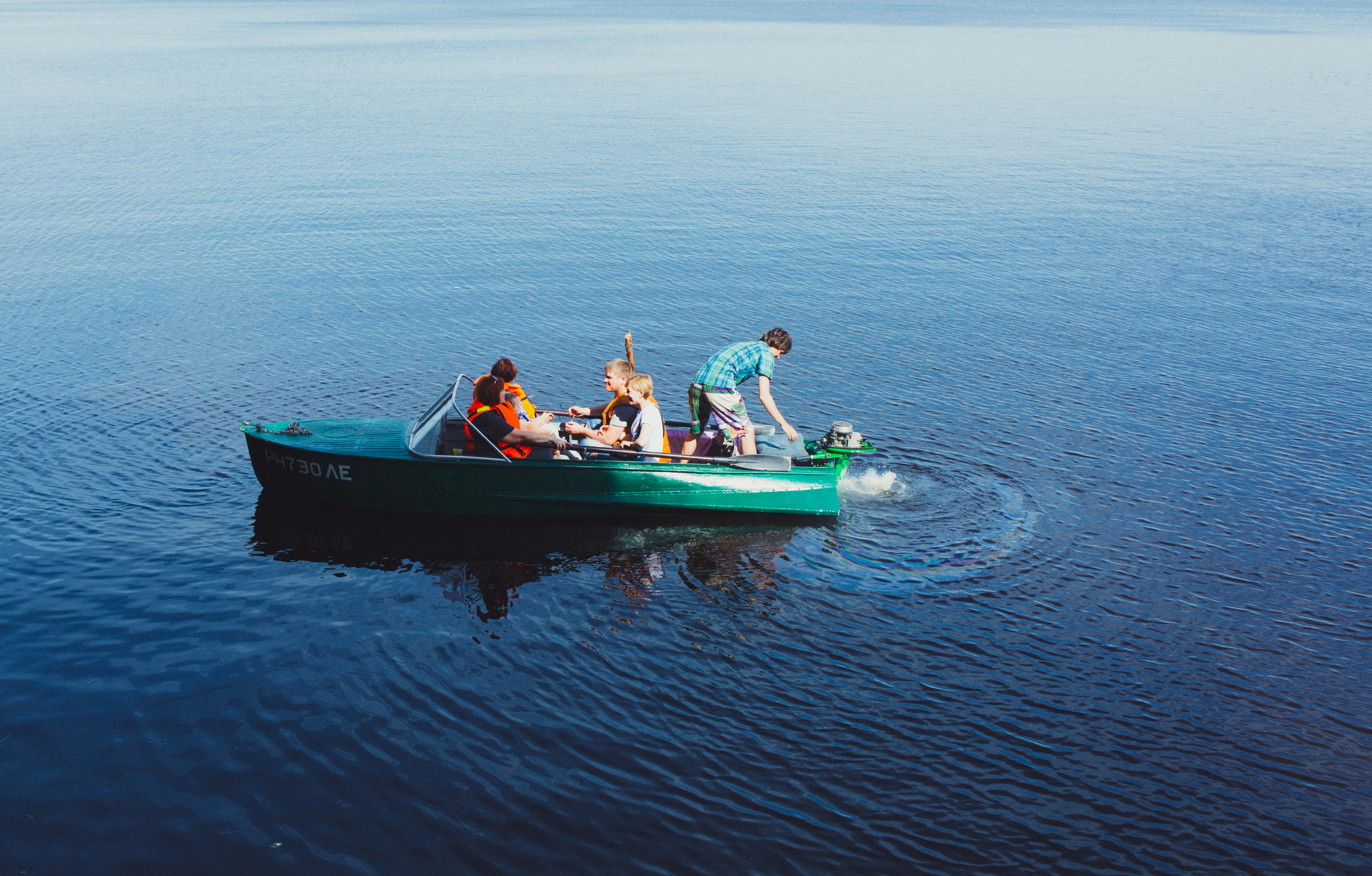 people riding power boat